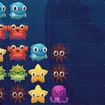 Coloridos personajes marinos dispuestos en una cuadrícula sobre un fondo azul oscuro