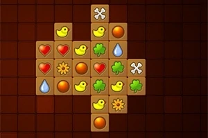 Cuadrícula con fichas de símbolos como patos, corazones, gotas de agua y tréboles en un tablero oscuro