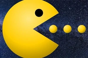 Figura amarilla en forma de círculo con boca abierta, frente a tres esferas en un fondo estrellado