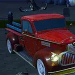Camioneta roja antigua estacionada en un cementerio durante la noche, rodeada de lápidas y calaveras