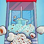 Máquina de palomitas de maíz en funcionamiento, con palomitas saliendo y esparciéndose