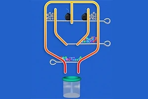 Tubos amarillos y naranjas con canicas de colores y dos bombas, sobre un fondo azul, con un frasco transparente en la parte inferior