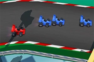 Cuatro pequeños vehículos de carreras, tres azules y uno rojo, compiten en una pista con bordes de color rojo y blanco