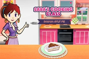 Mujer sonriente en una cocina colorida con un pastel de plátano en la mesa y un cartel que dice Saras Cooking Class: Banana Split Pie