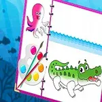 Dibujo de un cocodrilo coloreado junto a una paleta de pintura, pincel y un dibujo de un pulpo en un cuaderno