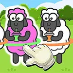 Tres ovejas con popotes, una de ellas de color rosa, cada una dentro de un hula hoop, en un pasto verde con un guante señalando