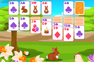 Cartas de juego con ilustraciones de conejos y símbolos, en un paisaje primaveral con flores, un conejo y una gallina