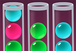 Tres tubos de ensayo transparentes verticales con esferas de colores brillantes, incluyendo azul, rosa y verde