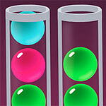 Tres tubos de ensayo transparentes verticales con esferas de colores brillantes, incluyendo azul, rosa y verde