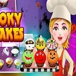 Una chef sostiene una bandeja con cupcakes decorados de Halloween en un entorno colorido, con imágenes de ingredientes y utensilios de cocina al fondo