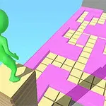 Figura verde de un personaje sobre una pila de bloques frente a un camino con patrón de cuadrados lilas y amarillos