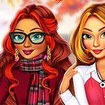 Dos mujeres sonrientes con cabello largo, una con gafas y bufanda, en un entorno otoñal con hojas coloridas