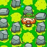 Personaje con barba y sombrero, rodeado de arbustos verdes y rocas grises en un campo