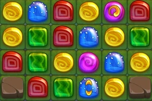 Mosaico de caramelos de colores brillantes en una cuadrícula sobre un fondo verde