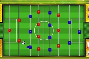 Vista aérea de un campo de futbol de mesa con jugadores rojos y azules