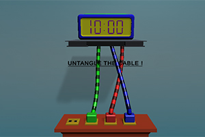 Reloj digital sobre una mesa con tres cables de colores entrelazados