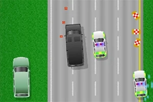 Vista aérea de dos coches patrulla persiguiendo a un vehículo negro en una carretera de múltiples carriles, con una sección de hierba al lado