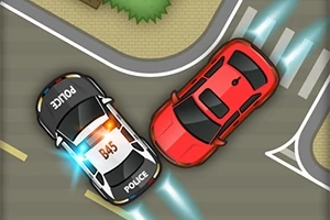 Coche de policía persiguiendo a un auto rojo en una intersección desde vista aérea