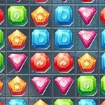 Interfaz con una cuadrícula llena de gemas coloridas de diferentes formas y colores, como rojas, verdes, azules y rosas