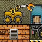 Truck Loader 4 Una grúa amarilla mueve una caja de madera hacia la parte trasera de un camión azul y negro en un entorno industrial