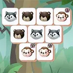 Varias fichas cuadradas con imágenes de animales como mapaches, osos y monos, sobre un fondo de bosque